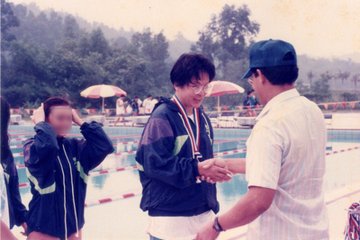 Helen Ang swimming medal